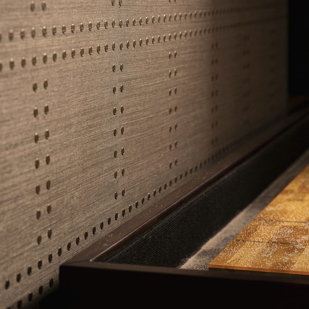 Custom built-in cabinetry detail with nailhead trim in a JK Home Design interior