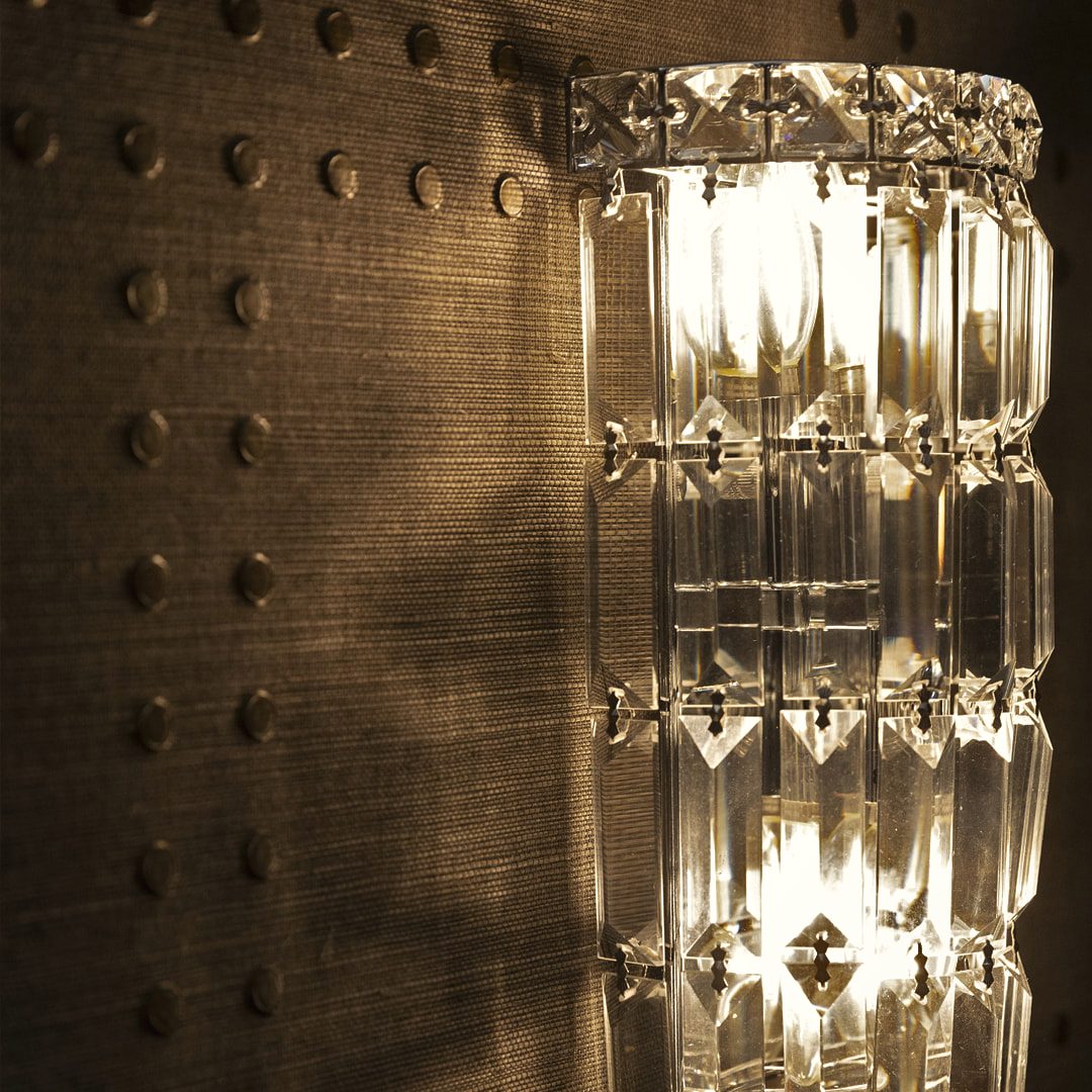 Illuminated mirrored cabinet detail with reflective glass